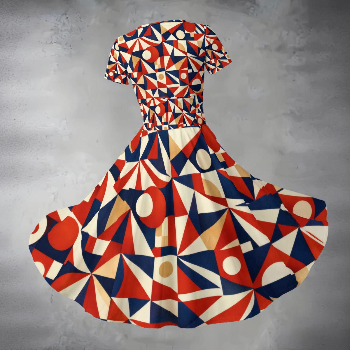 Geometric patterned dress on a gray background