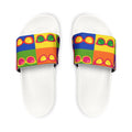 Pair of white slides with colorful patterned straps on a white background