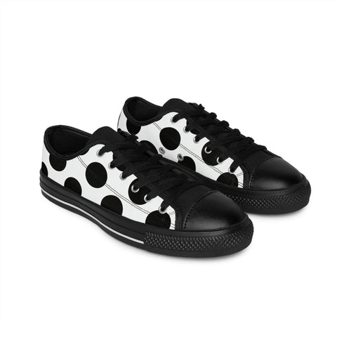Black and white polka dot sneakers on a white background
