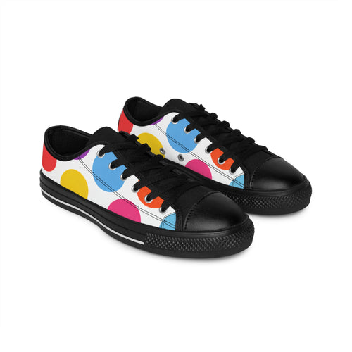 Black sneakers with colorful polka dot pattern on a white background