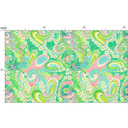 Colorful paisley pattern fabric with measurement scale on a white background