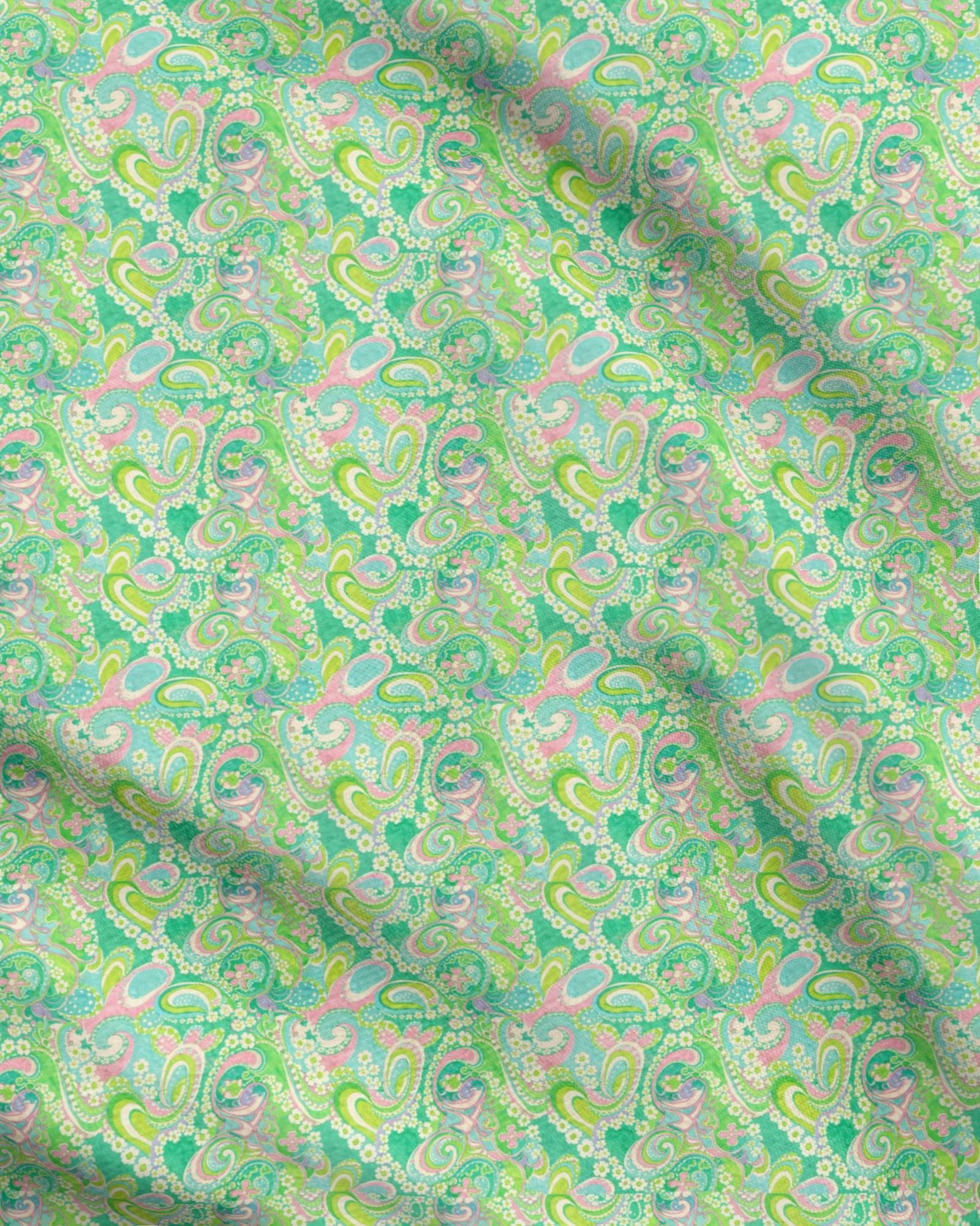 Patterned fabric with green and pink tones