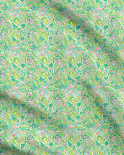 Patterned fabric with green and pink tones
