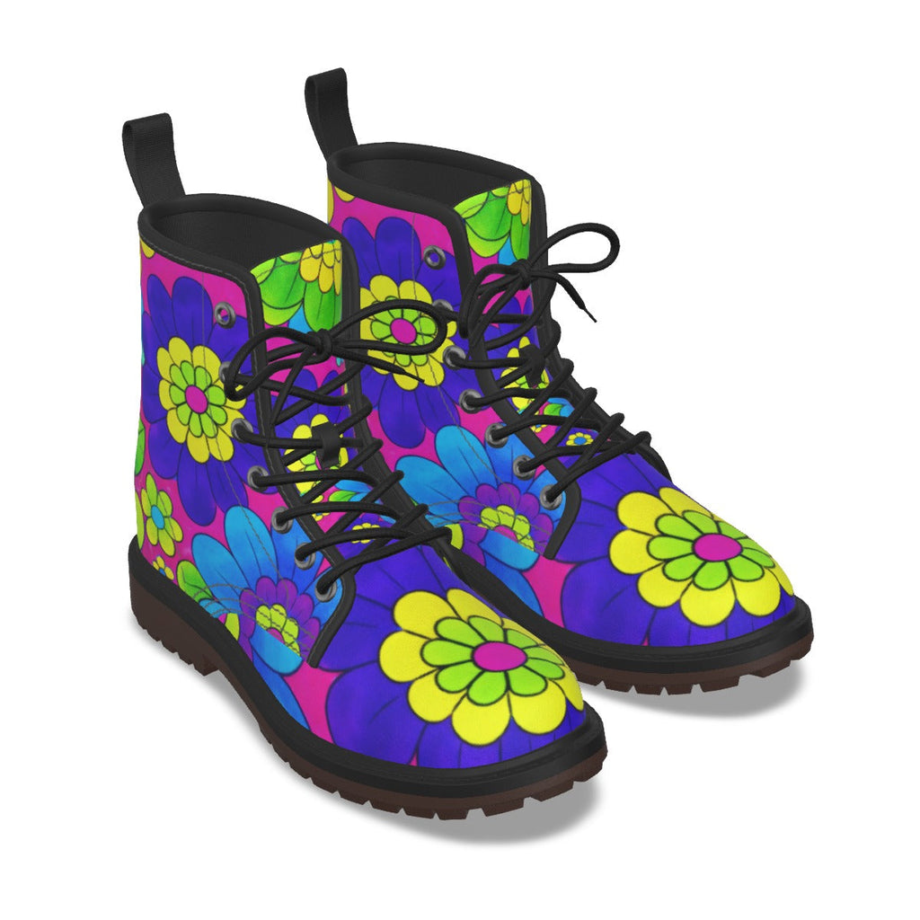 A pair of lace-up ankle boots with a vibrant 70s-style floral pattern featuring purple, blue, green, and yellow flowers on a dark background, shown against a plain white background.