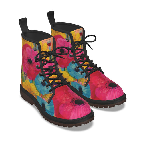 A pair of lace-up ankle boots with a vibrant floral print featuring pink poppies, yellow flowers, and blue blossoms on a white background.
