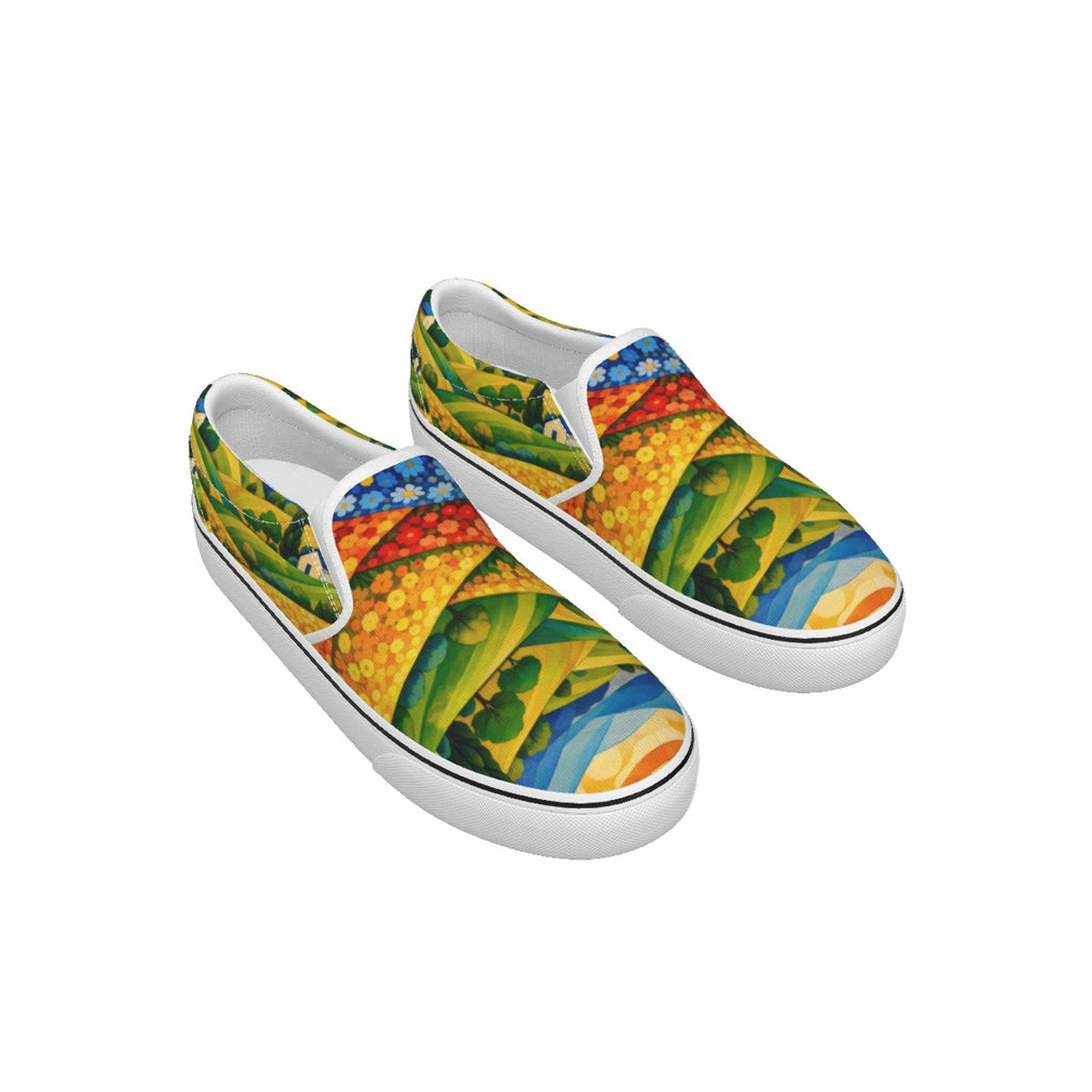 A pair of slip-on canvas sneakers with a vibrant, multicolored abstract pattern featuring green, yellow, blue, red, and orange shapes, set against a plain white background.