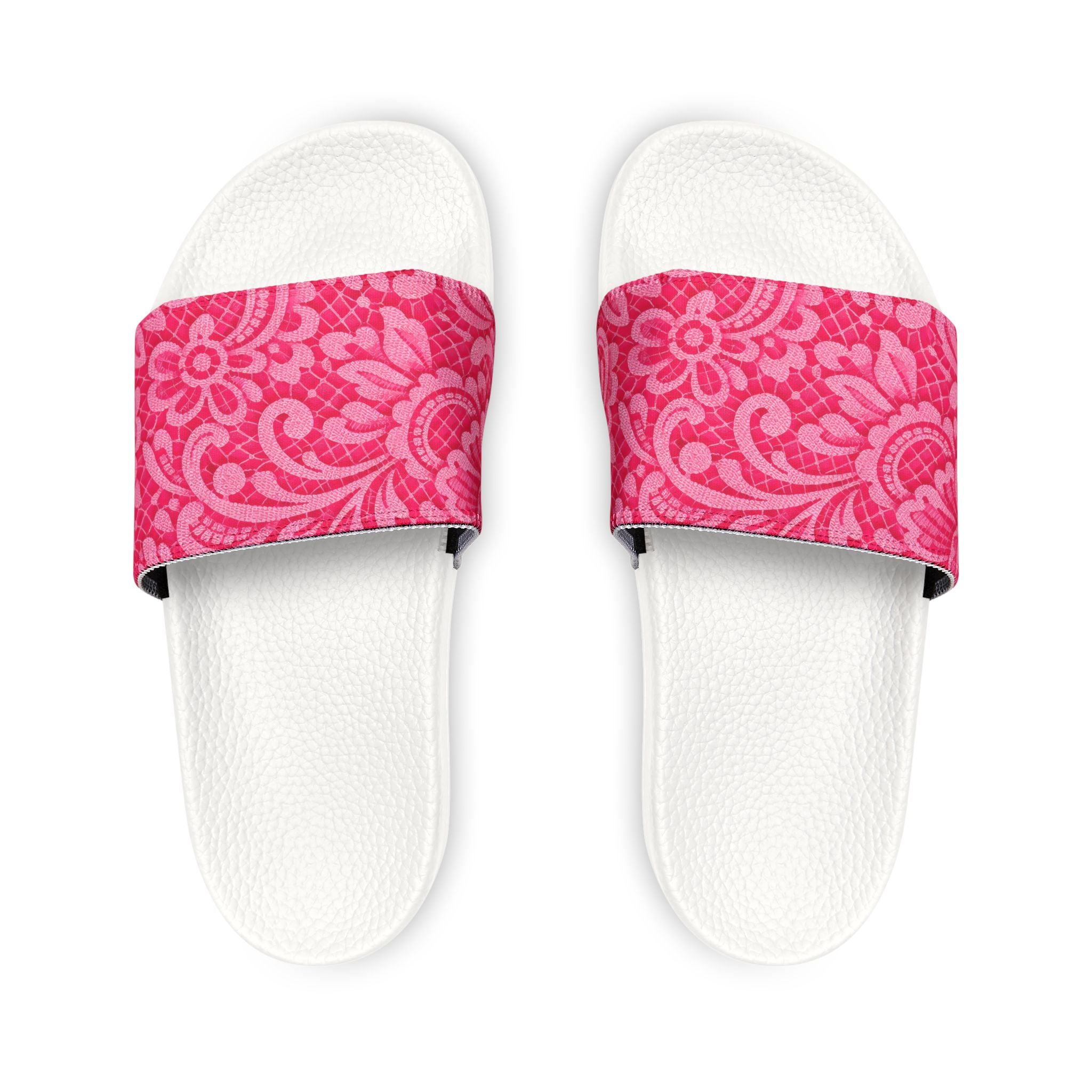 White slides with pink floral straps on a white background